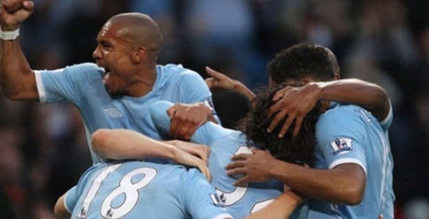 Premiership: Tevez claims two as City cream Reds